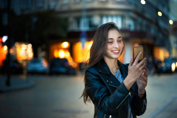 istock Young girl using her smartphone 1142764446