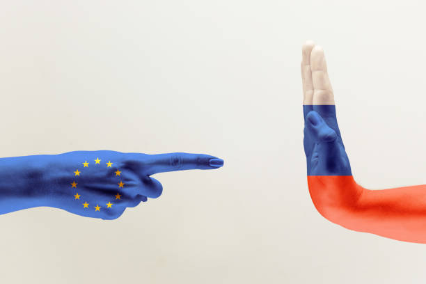 istock Hand colored in flags of EU and Russia 1142764756