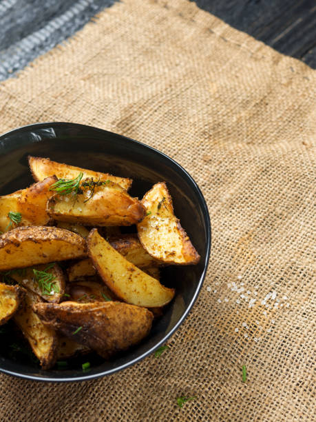 istock Country potatoes with dill and spices copy space 1142768132
