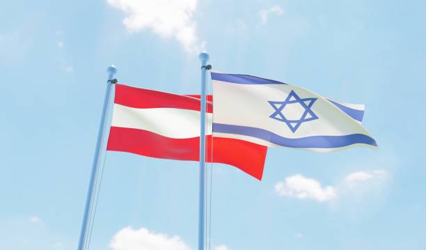 istock Austria and Israel, two flags waving against blue sky 1142769197
