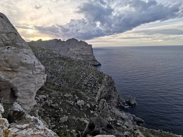 istock Dramatic evening sky above rock cliffs and ocean at Cabo Formentor 1142769354