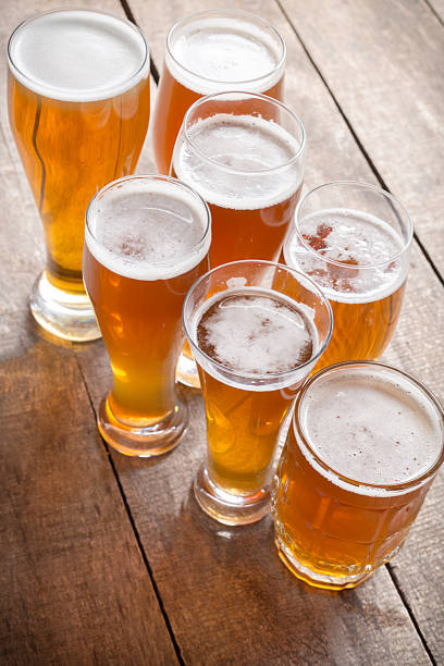 istock glass beer on wood background 1142771822