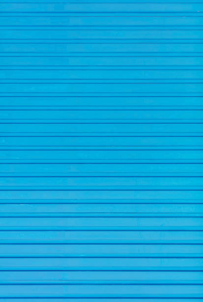 istock Corrugated metal panel painted in blue color 1142774725