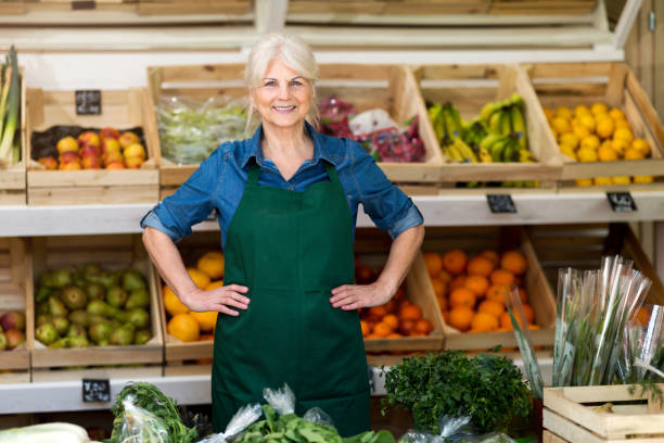 istock Senior woman working in small grocery store 1142775509