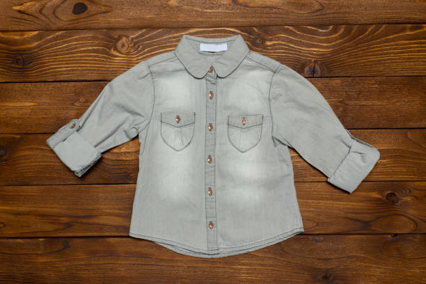 istock clothes on wooden table 1142776137
