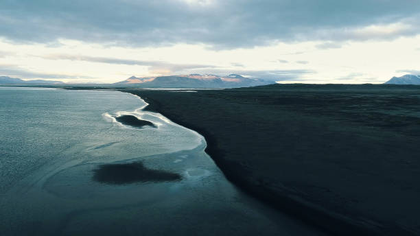 istock Icelandic coastline. Black, rocky beach. Aerial view 1142776297