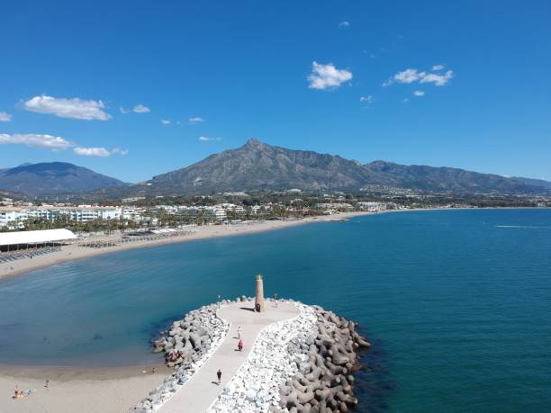 istock The sea, the lighthouse and the mountain 1142779892