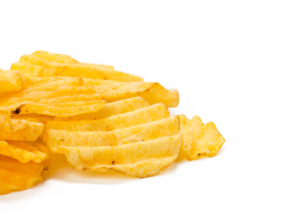 istock yellow potato chips isolated on white 1142780860
