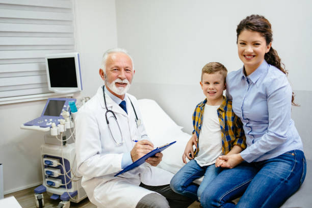 istock Little boy with his mother visiting doctors office 1142784409