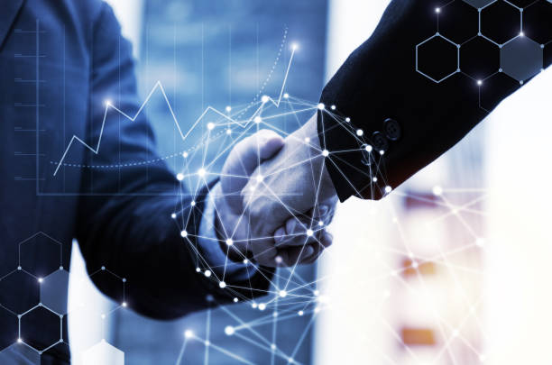 istock business man handshake with effect global network link connection and graph chart of stock market graphic diagram, digital technology, investment, internet communication, teamwork, partnership concept 1142784629