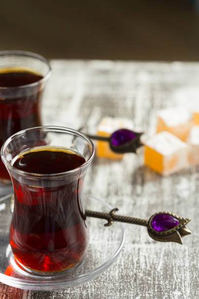 istock Red tea in turkish glasses on a wooden table 1142785140
