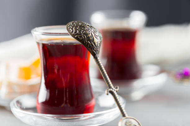 istock Red tea in turkish glasses on a wooden table 1142785144
