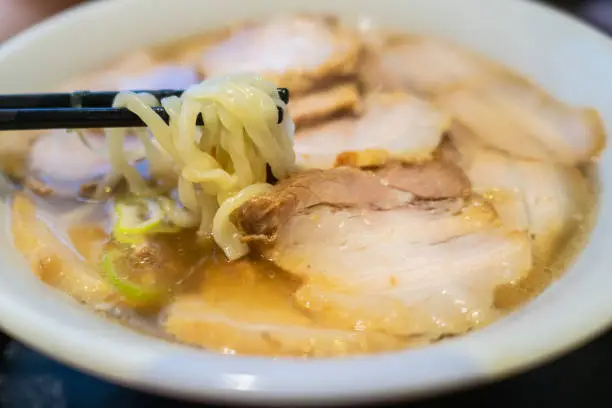 The characteristics of the Kitakata Ramen. The noodle is thick, flat and frizzy. The orthodox soup is the simple soy-taste one.