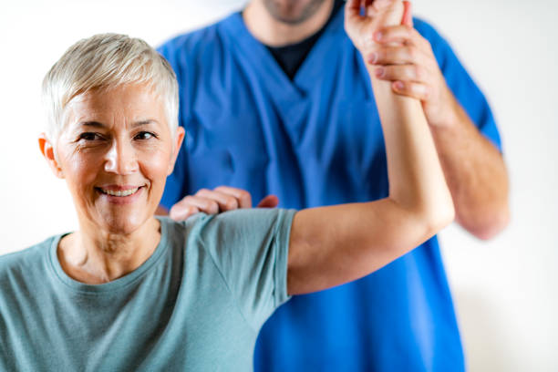 istock Therapist Checking Senior Woman’s Arm 1142786169