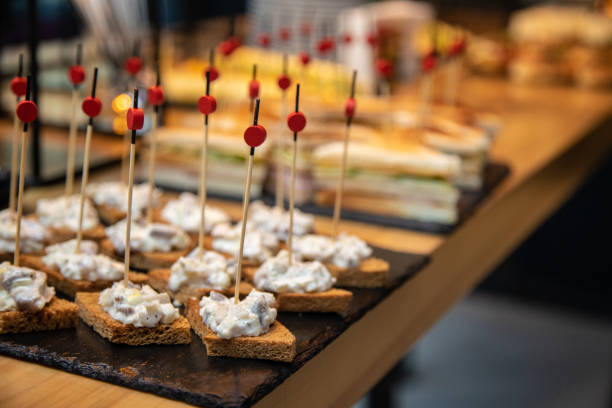 istock Beautifully decorated catering banquet table with different food snacks 1142786569
