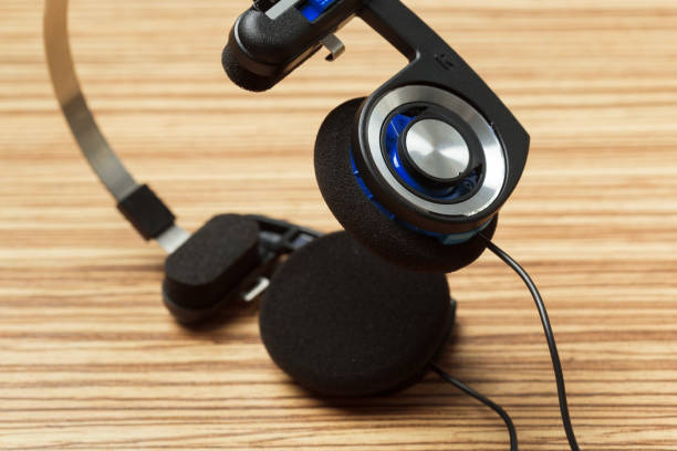 istock headphone on wooden table 1142788252