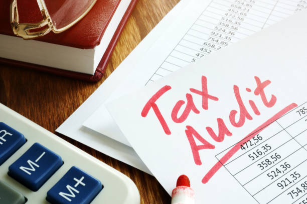 Tax audit handwriting on business accounting documents. Tax audit handwriting on business accounting documents. irs office stock pictures, royalty-free photos & images
