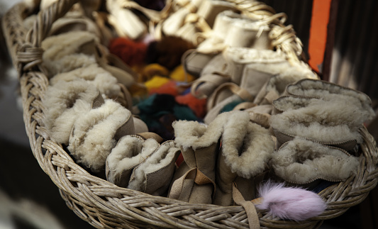 Sheepskin shoes in fashion, animals and fur shop