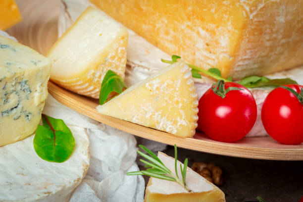 istock cheese on wooden table 1142790009