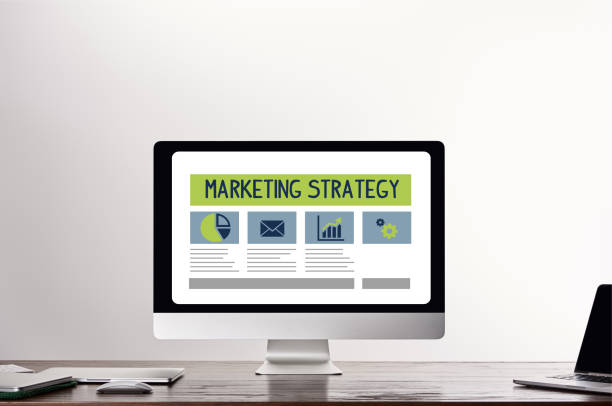 istock computer with marketing strategy illustration on screen at workplace on grey background 1142790354