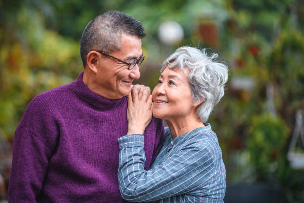 istock Smiling senior couple standing at back yard 1142791466