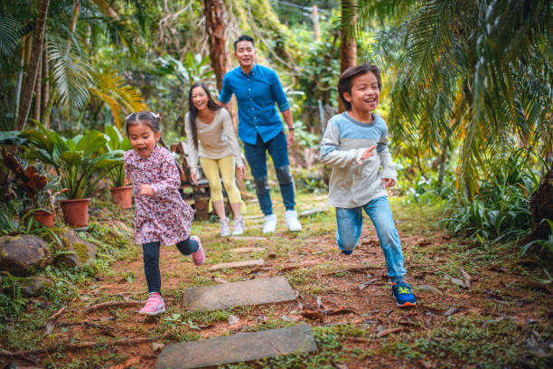 istock Parents cheering children running in back yard 1142791475
