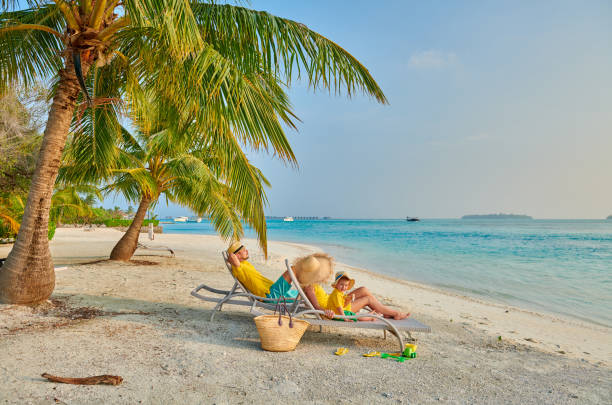 Family with three year old boy on beach