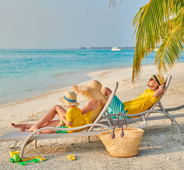 istock Family with three year old boy on beach 1142792347