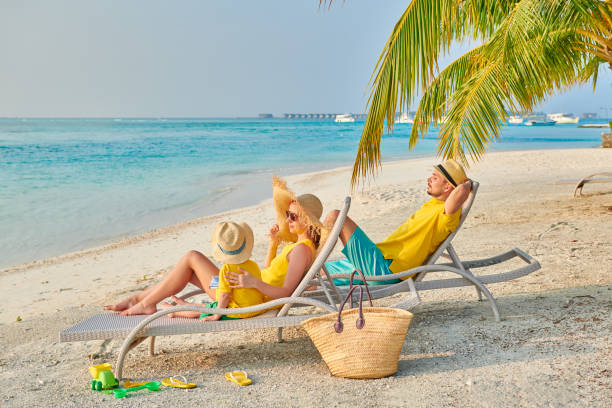 istock Family with three year old boy on beach 1142792360