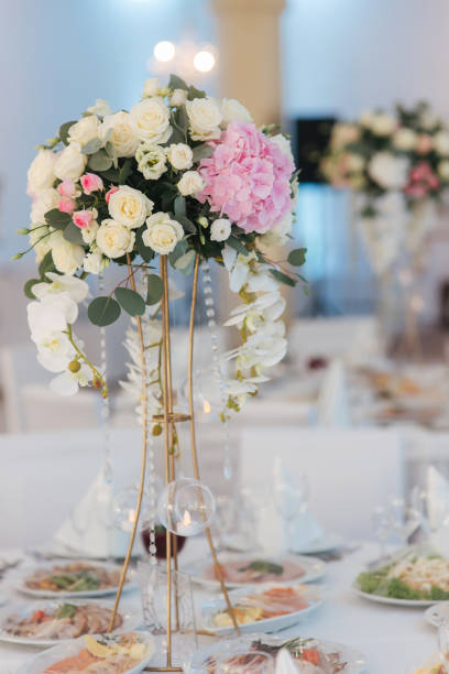 istock Wedding bouquet in restaurant on the table. Pink and white flowers. Rose and hydrangea 1142794329
