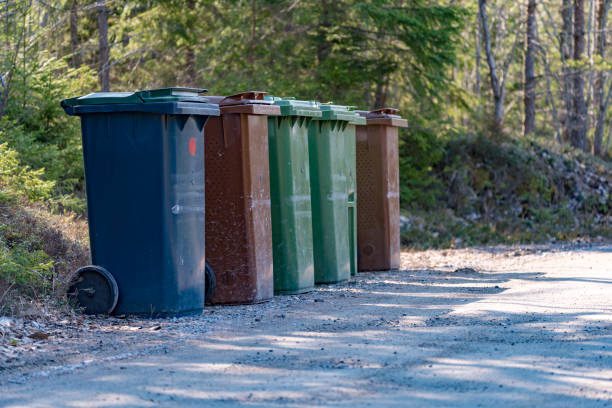 istock Trash cans standing beside a gravel road 1142794360