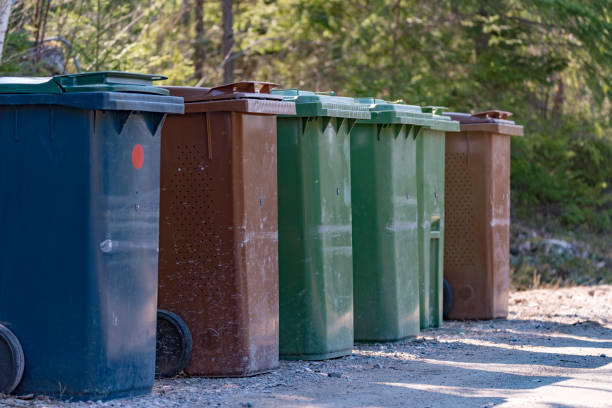 istock Trash cans standing beside a gravel road 1142794361
