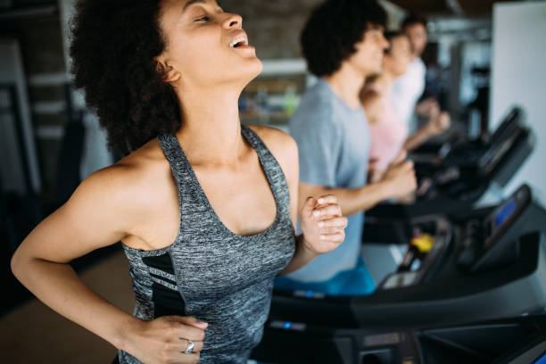 istock Group of young people training in gym 1142795949