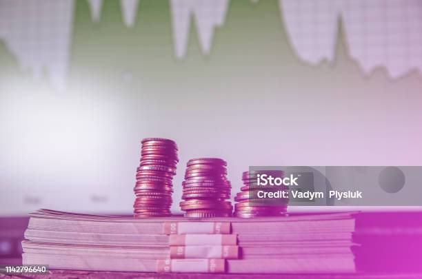 Money With Coins And Diagrams On Background Dollars Photo Inflation Rates Price Growth Exchange House And Brokers Board Economics Concept Stock Photo - Download Image Now