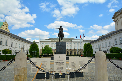 WARSAW, POLAND - JUNE 29, 2018.   Polish presidential palace in Warsaw with statue of Prince Jozef Poniatowski\nat Krakowskie Przedmiescie street in Warsaw, Poland.