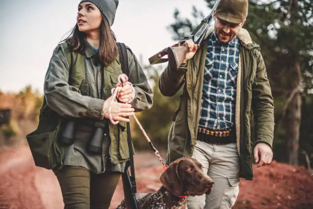 Men and women hunting in nature