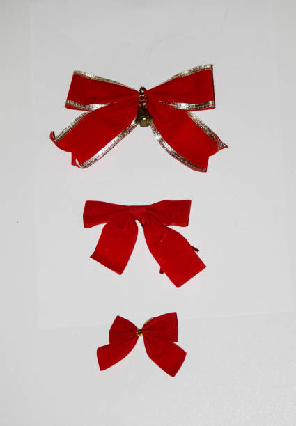 istock Christmas decoration, red bows of different sizes on a white background 1142798669