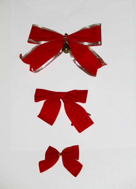istock Christmas decoration, red bows of different sizes on a white background 1142799113
