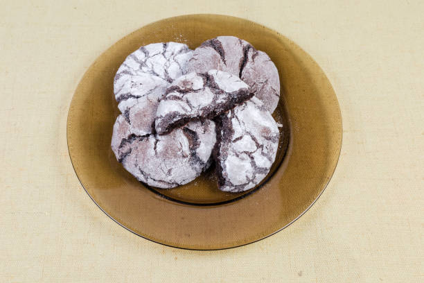 istock Round brownie cookies on glass dish on a fabric surface 1142799757