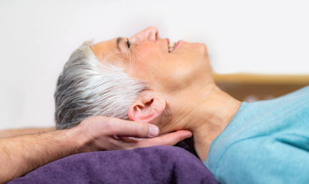 istock Physical Therapist Working with Neck. Senior Woman 1142801146