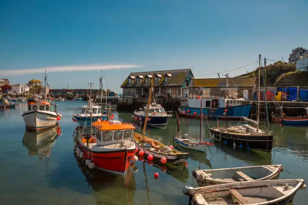 Fishing boats in the harbor of Mevagissey in Cornwall England