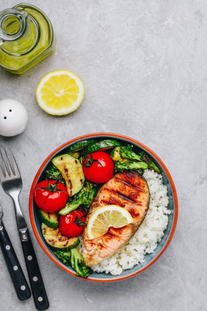 istock Grilled salmon steak with and rice, zucchini, broccoli, tomato . 1142802761