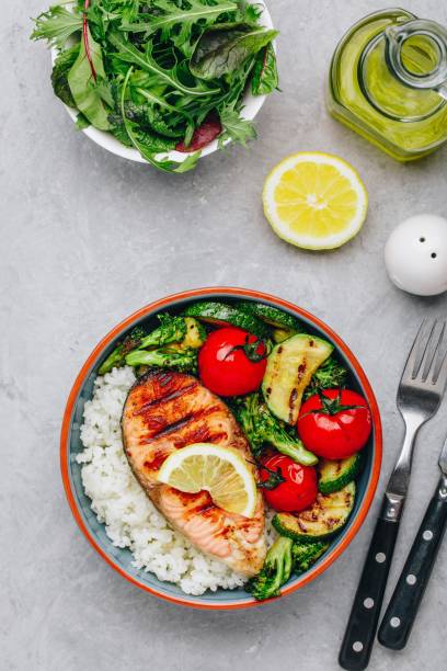 istock Grilled salmon steak with and rice, zucchini, broccoli, tomato . 1142802804