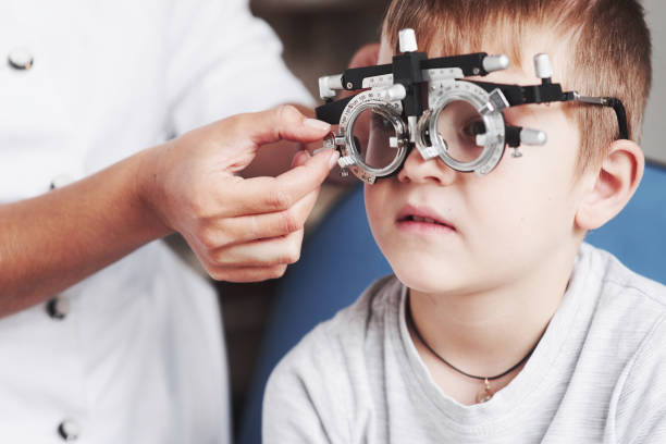 istock Please concentrate. Child sitting in the doctor's cabinet and have tested his visual acuity 1142803332