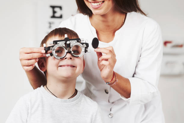 istock Feels good. Child sitting in the doctor's cabinet and have tested his visual acuity 1142803840