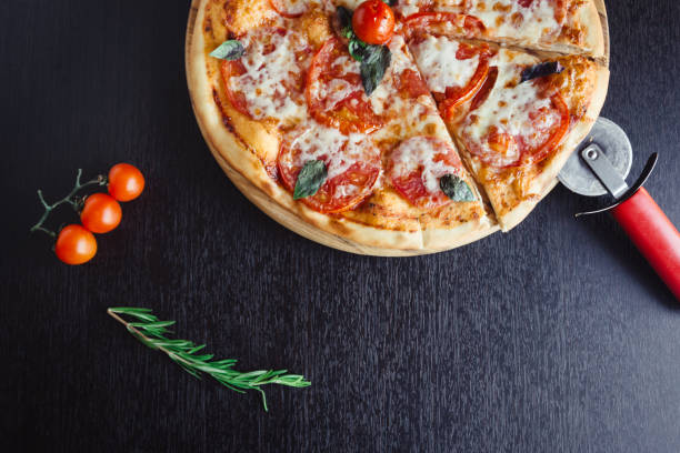 istock Italian Pizza on the Board in the dark table 1142803897