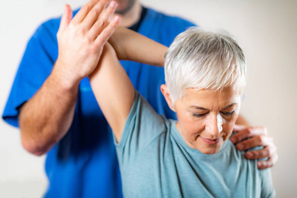 istock Therapist Checking Senior Woman’s Arm 1142803956
