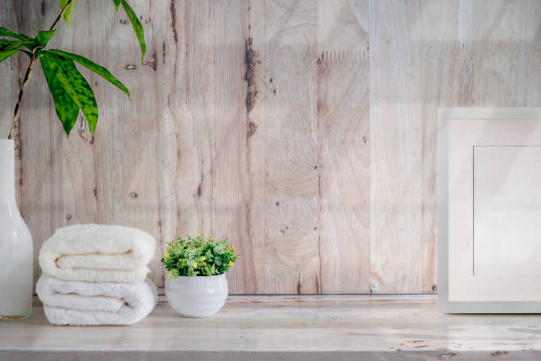 istock Mockup bath towels on wooden table with copy space. 1142803997
