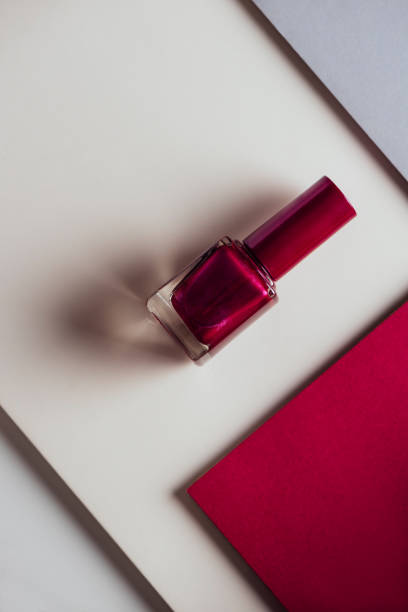 istock nail polish on the geometric colorful pattern background. Product and makeup concept. 1142804062