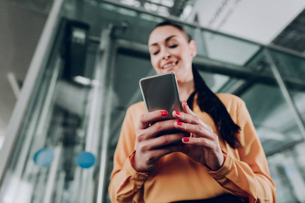 istock Woman writing messages on her cell phone 1142805162